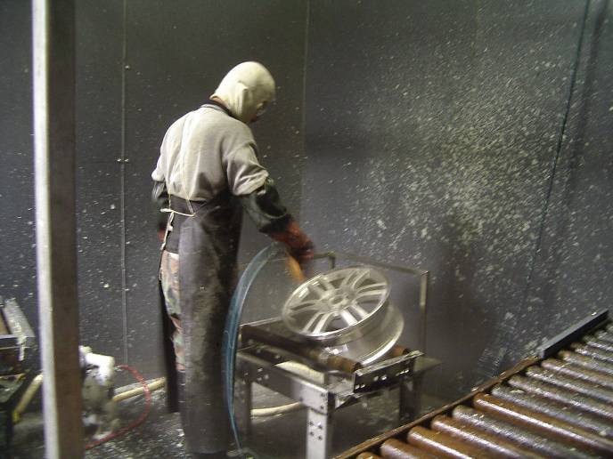 remove paint: powder and excess coating from recessed areas on the aluminum wheel surface